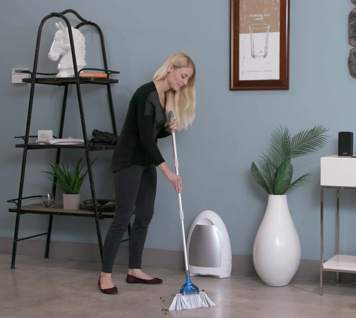 Woman sweeping in front of EyeVac